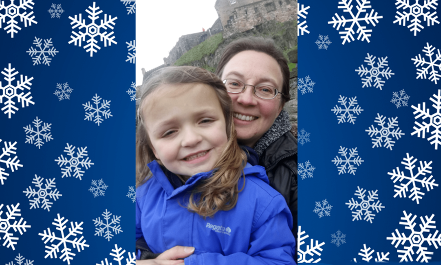 Amelia, aged five, smiling and healthy, poses with her mum outside Edinburgh castle.