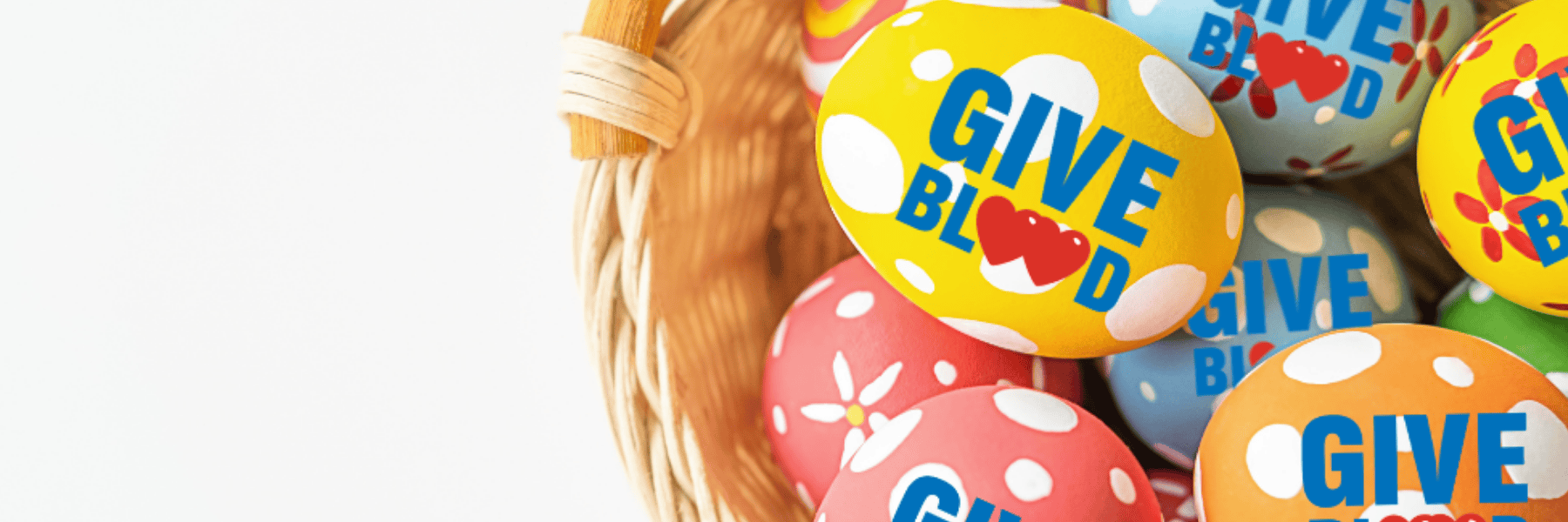 Easter eggs in a basket with 'Give Blood' logo
