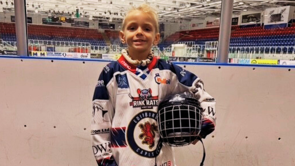 Lochie wearing his ice hockey uniform